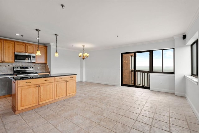 kitchen featuring appliances with stainless steel finishes, a chandelier, decorative backsplash, crown molding, and hanging light fixtures