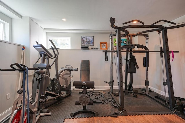 workout room featuring recessed lighting, baseboards, and plenty of natural light