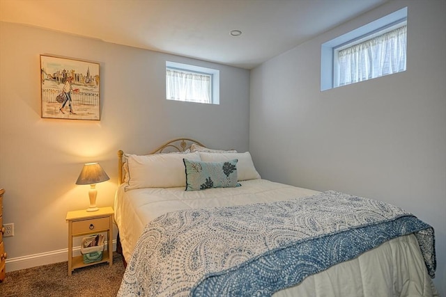 carpeted bedroom featuring baseboards