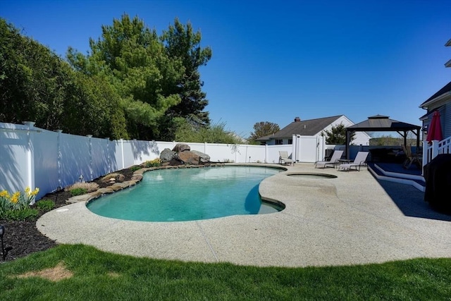 view of swimming pool featuring a patio, a gazebo, a fenced in pool, and a fenced backyard