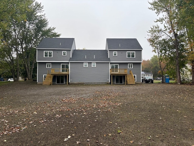 rear view of house featuring a deck