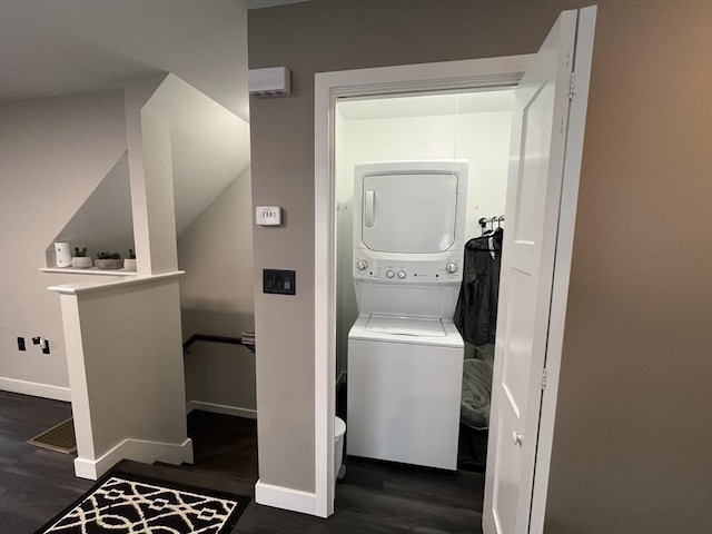445 Cambridge St, Worcester, MA 01610 - laundry area featuring stacked washer / dryer, wood finished floors, and baseboards