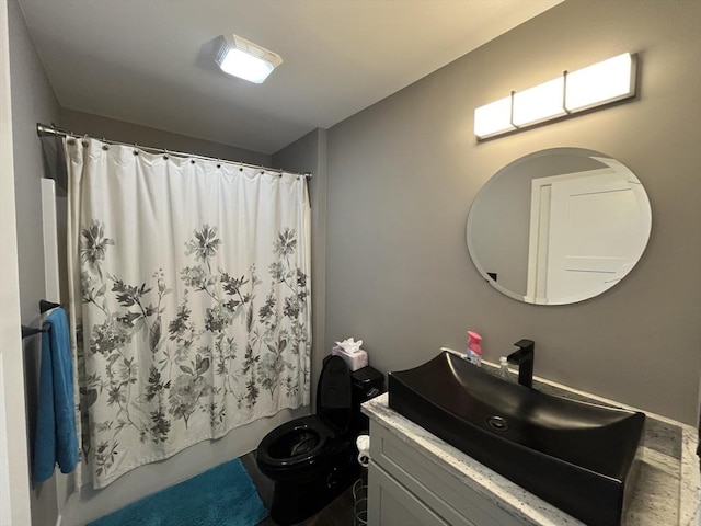 445 Cambridge St, Worcester, MA 01610 - bathroom featuring vanity, toilet, and shower / tub combo with curtain