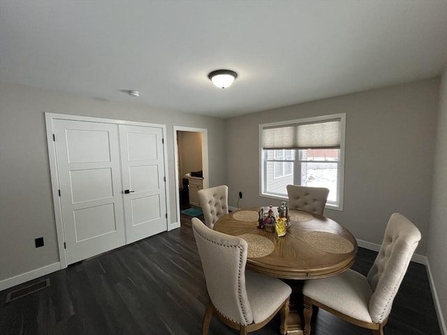 445 Cambridge St, Worcester, MA 01610 - dining area featuring baseboards and dark wood-style floors
