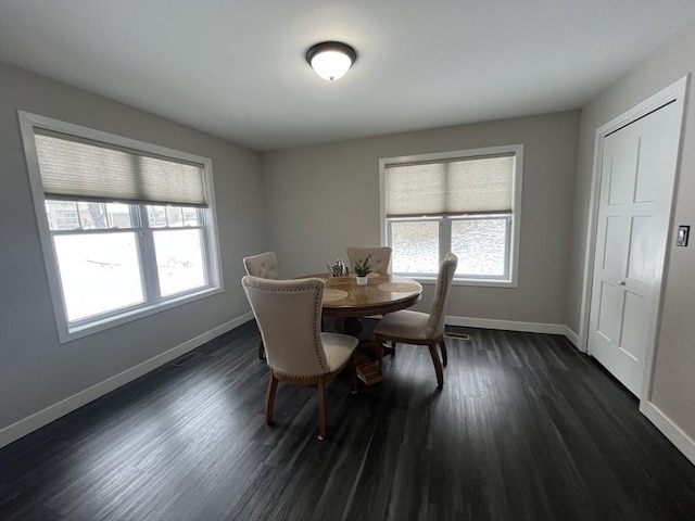 445 Cambridge St, Worcester, MA 01610 - dining area featuring baseboards and dark wood finished floors