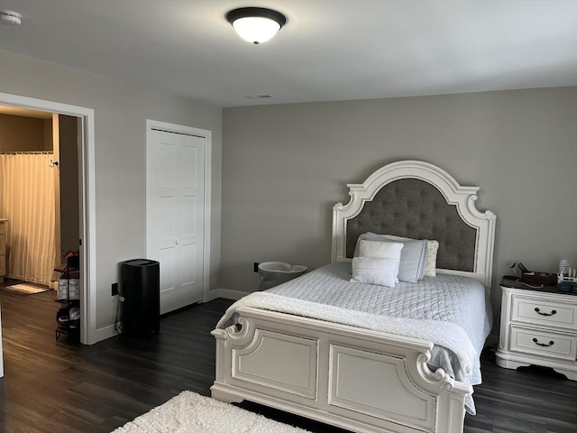 445 Cambridge St, Worcester, MA 01610 - bedroom with dark wood-style floors, a closet, and baseboards