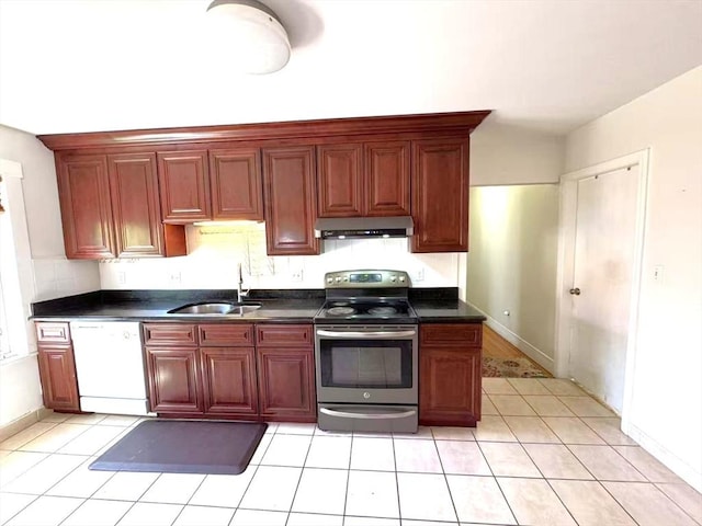 kitchen featuring stainless steel electric range oven, white dishwasher, dark countertops, a sink, and under cabinet range hood