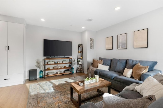 living room with light hardwood / wood-style flooring