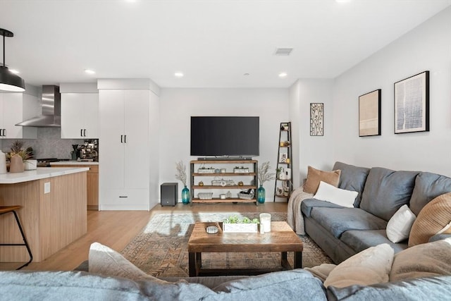 living room with light hardwood / wood-style floors