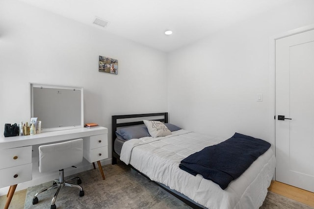 bedroom with hardwood / wood-style flooring