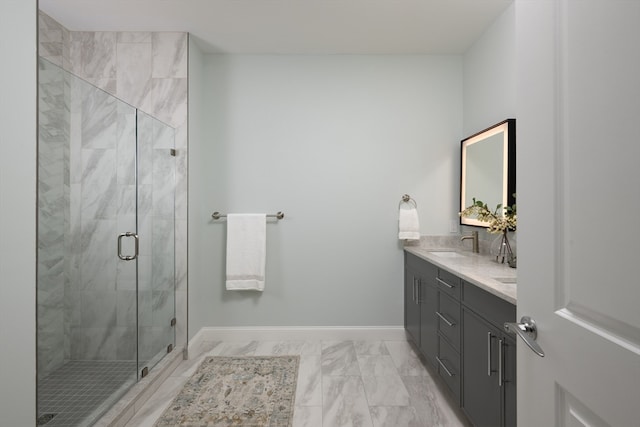 bathroom with vanity and a shower with shower door