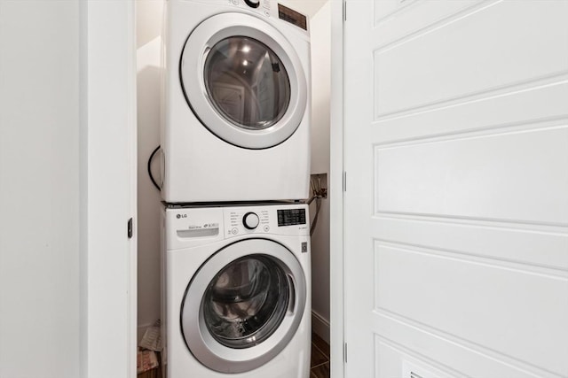 laundry room featuring stacked washer and clothes dryer