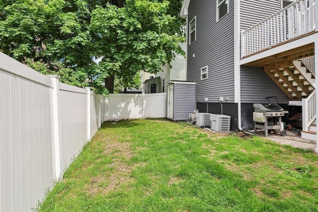 view of yard featuring stairs and cooling unit