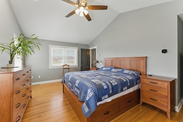 bedroom featuring vaulted ceiling, a ceiling fan, light wood finished floors, and baseboards