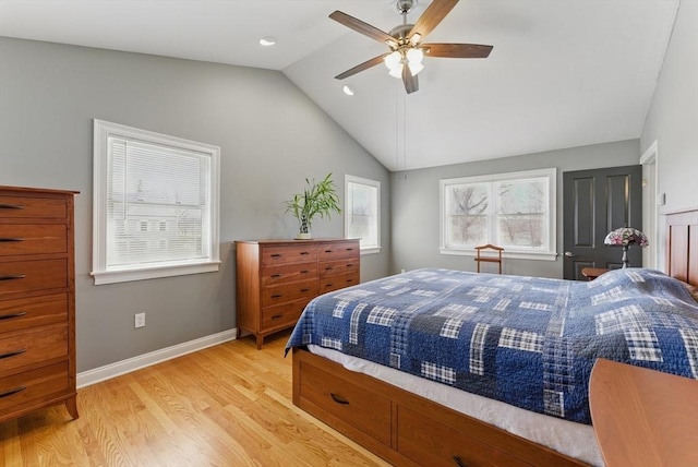 bedroom with baseboards, lofted ceiling, a ceiling fan, and light wood-style flooring