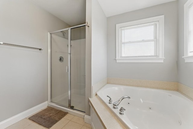 full bath featuring tile patterned flooring, a whirlpool tub, and a stall shower
