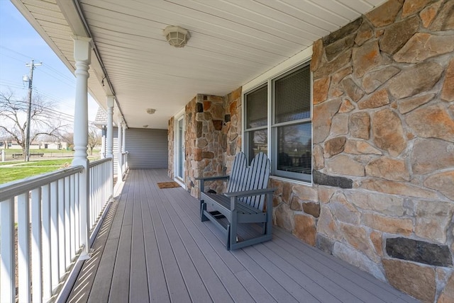 wooden terrace featuring a porch