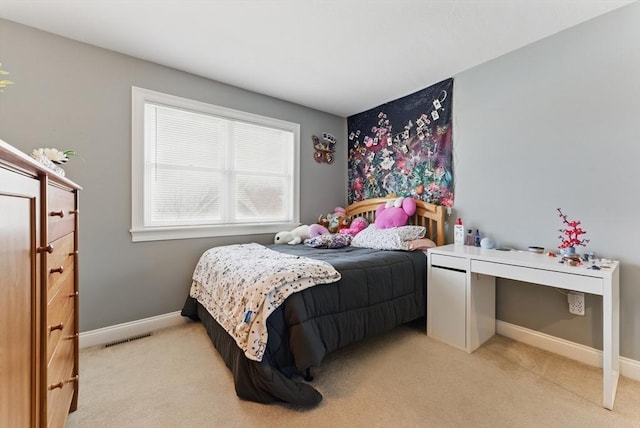 bedroom featuring light carpet, visible vents, and baseboards