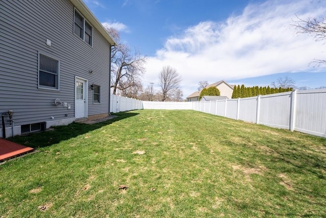 view of yard with a fenced backyard
