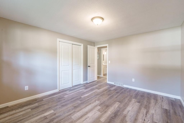 70 Ferncroft St, Longmeadow, MA 01106 - unfurnished bedroom featuring wood finished floors and a closet