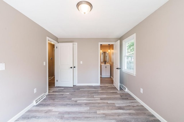 70 Ferncroft St, Longmeadow, MA 01106 - unfurnished bedroom with wood finished floors and ensuite bathroom