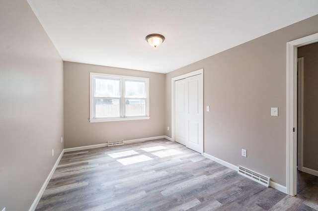 70 Ferncroft St, Longmeadow, MA 01106 - unfurnished bedroom featuring wood finished floors and a closet