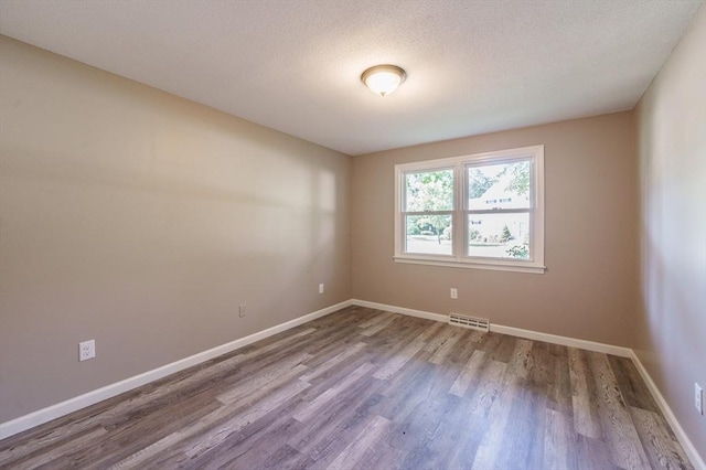 70 Ferncroft St, Longmeadow, MA 01106 - spare room featuring wood finished floors and a textured ceiling