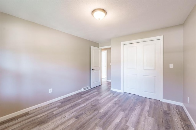 70 Ferncroft St, Longmeadow, MA 01106 - unfurnished bedroom featuring wood finished floors and a closet
