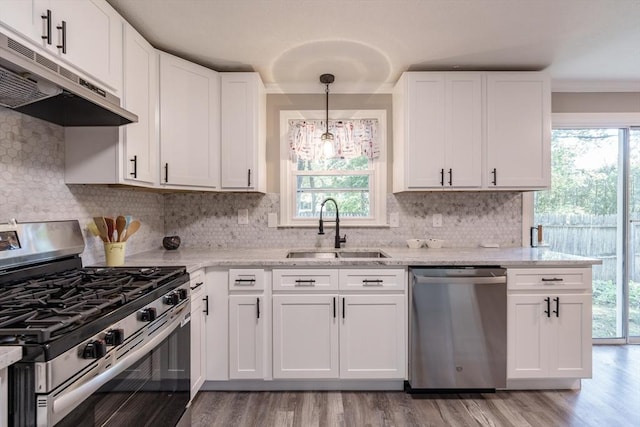 70 Ferncroft St, Longmeadow, MA 01106 - kitchen with appliances with stainless steel finishes, exhaust hood, white cabinetry, plenty of natural light, and crown molding