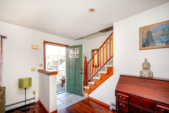 entrance foyer featuring a baseboard radiator and light wood-type flooring