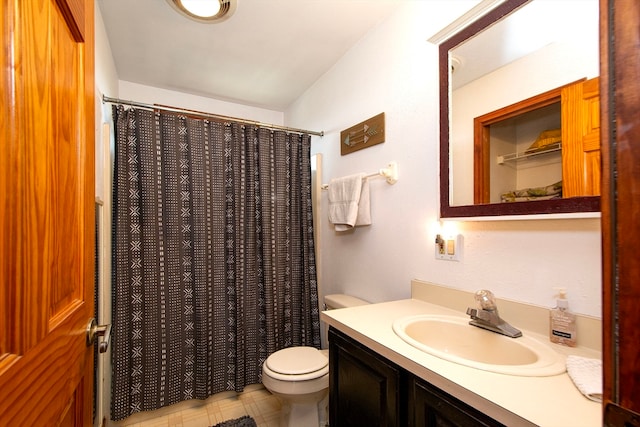 bathroom featuring toilet, vanity, and a shower with shower curtain