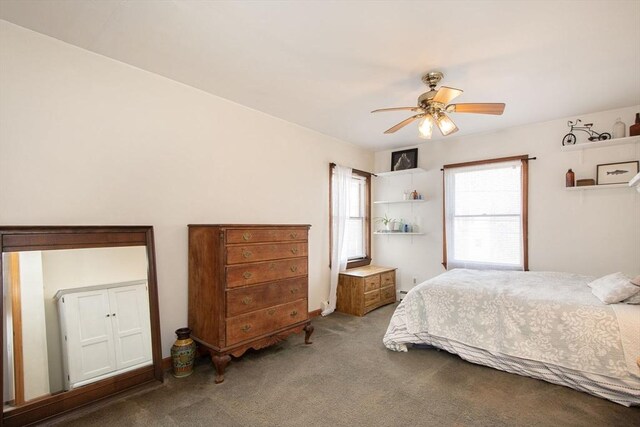 carpeted bedroom featuring a ceiling fan