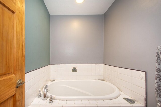 bathroom with a garden tub