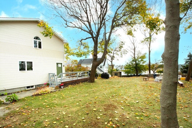 view of yard with a wooden deck