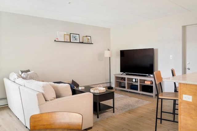 157 Franklin St Unit D3, Stoneham, MA 02180 - living area featuring light wood-style floors and a baseboard radiator