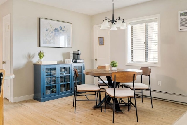 157 Franklin St Unit D3, Stoneham, MA 02180 - dining area featuring light wood finished floors, a chandelier, and a baseboard radiator
