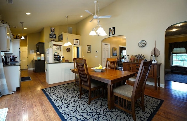 895 Dennison Dr, Southbridge, MA 01550 - dining room featuring arched walkways, a ceiling fan, wood finished floors, recessed lighting, and high vaulted ceiling
