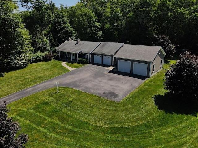 895 Dennison Dr, Southbridge, MA 01550 - view of front of home featuring asphalt driveway, a front yard, and an attached garage