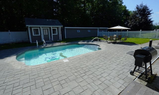 895 Dennison Dr, Southbridge, MA 01550 - view of swimming pool with a patio, an exterior structure, a fenced backyard, and an outdoor structure