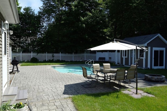 895 Dennison Dr, Southbridge, MA 01550 - view of pool featuring an outdoor fire pit, an outbuilding, a fenced backyard, and a patio area