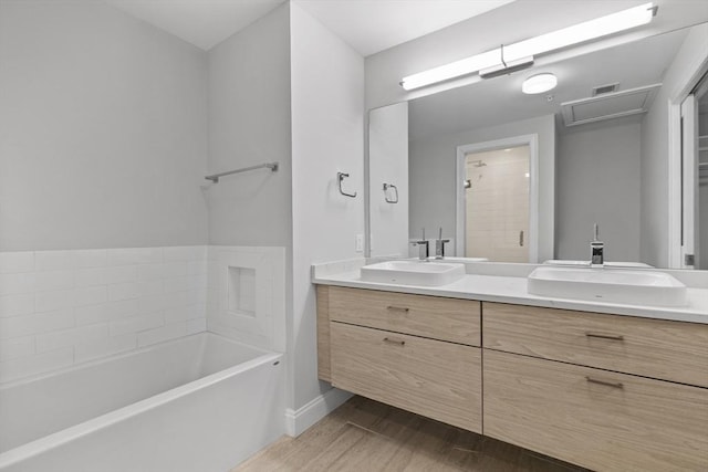 bathroom featuring vanity and a bathing tub