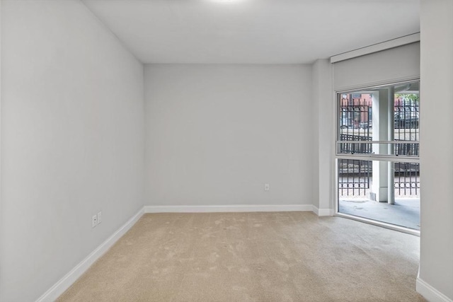 empty room with light colored carpet