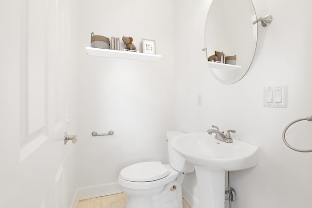 bathroom featuring toilet and tile patterned floors