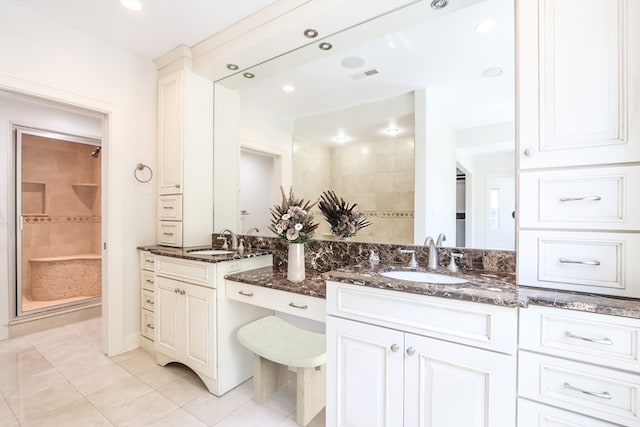 bathroom with vanity and tile patterned flooring