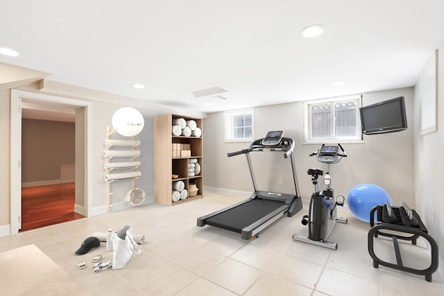 workout room featuring light hardwood / wood-style flooring