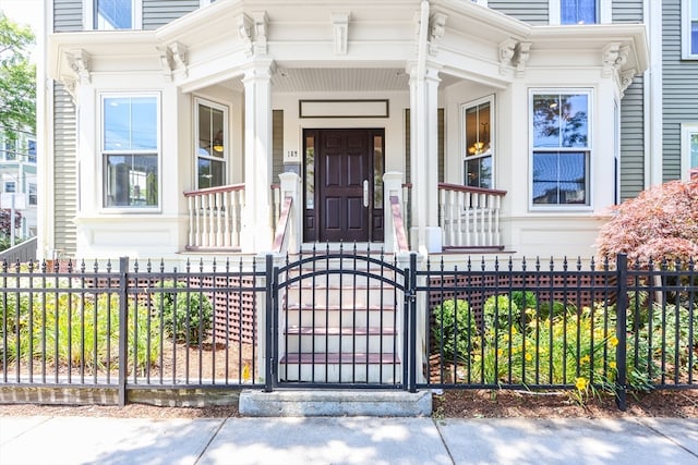 view of exterior entry with covered porch