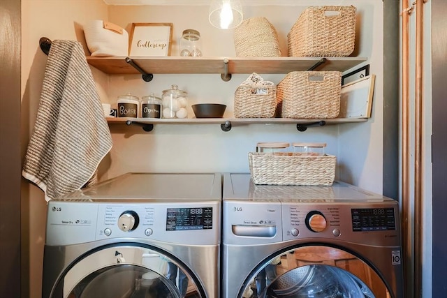 washroom with laundry area and independent washer and dryer