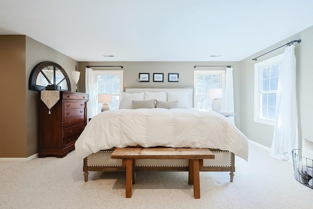 bedroom featuring visible vents, baseboards, and carpet floors