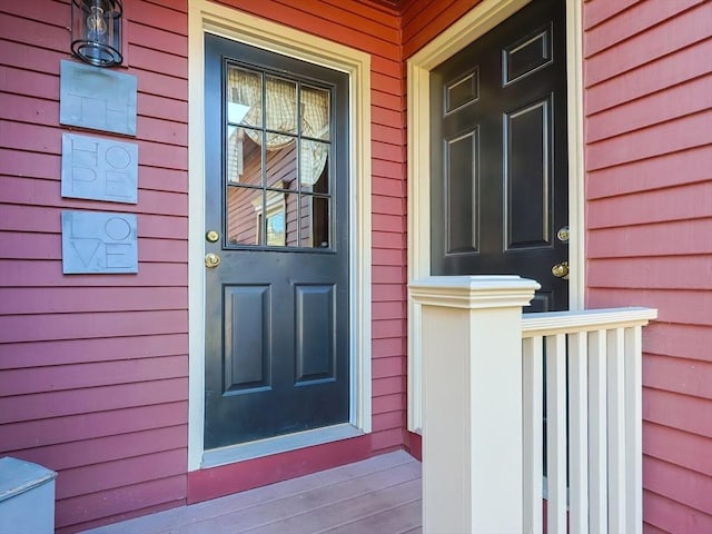 doorway to property featuring covered porch