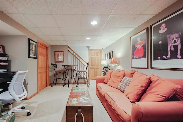 living room featuring recessed lighting, a paneled ceiling, baseboards, and carpet flooring